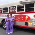 Two dental team members by a food truck