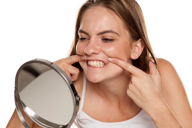 Patient checking their oral health after eating